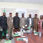 The Nigeria Digital ID4D delegation posing for a group photograph with the NITDA DG and some members of his management team during the visit