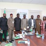 The Nigeria Digital ID4D delegation posing for a group photograph with the NITDA DG and some members of his management team during the visit